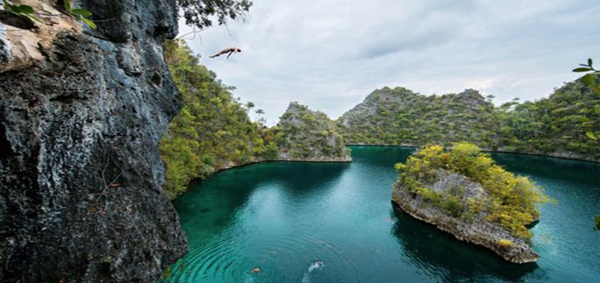 Cliff Diving Into An Indonesian Paradise